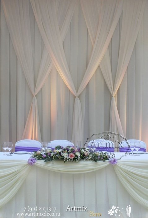 Оформление зала на свадьбу тканями и цветами.